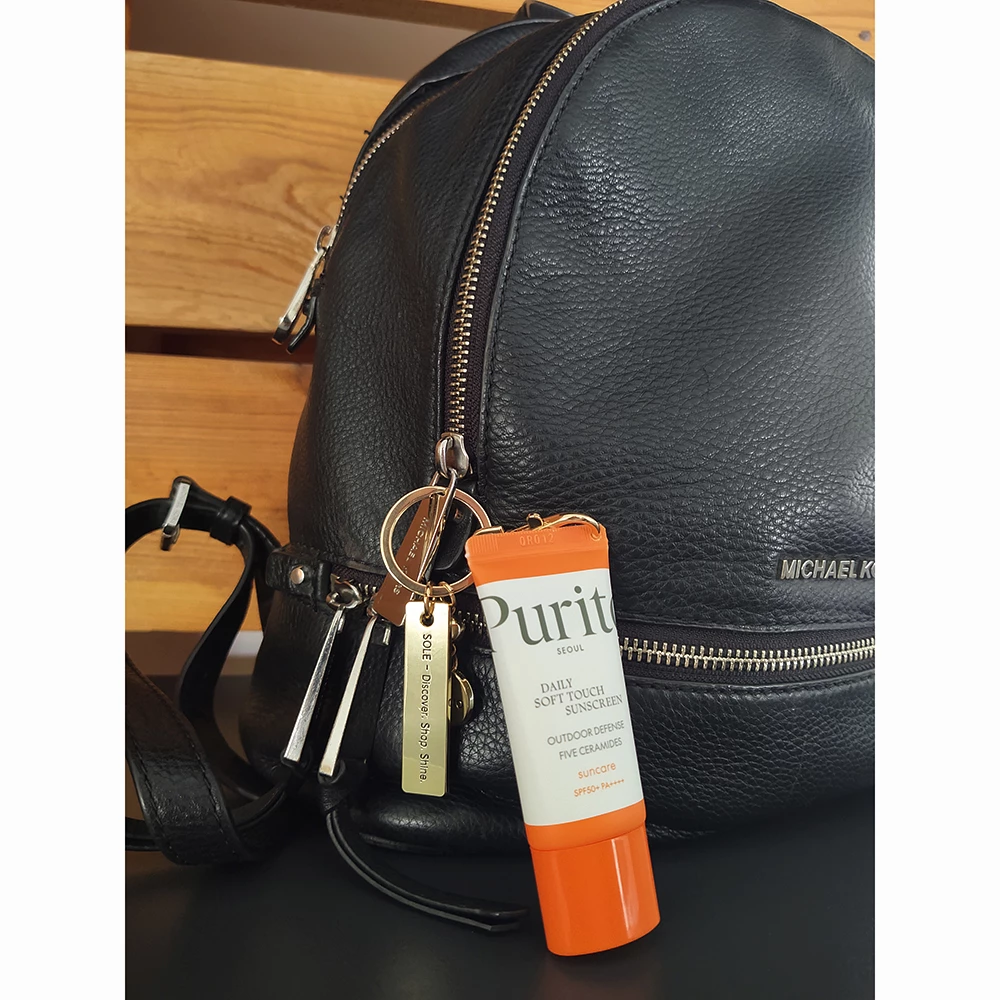 SPF TO GO - breloc aurit premium + Purito Daily Soft Touch Crema de față SPF 50+ mini (15 ml) - editie limitata