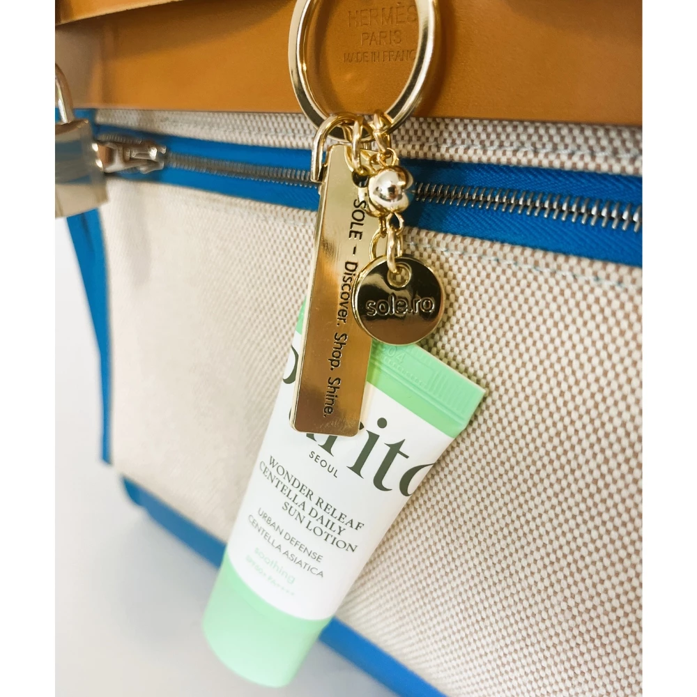 SPF TO GO - Breloc auriu premium + Purito Wonder Releaf Centella Daily Sun Lotion SPF 50+ PA++++ mini (15 ml) - editie limitata